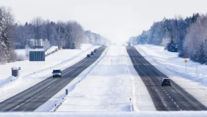 A bridge view down onto the freeway, winter setting