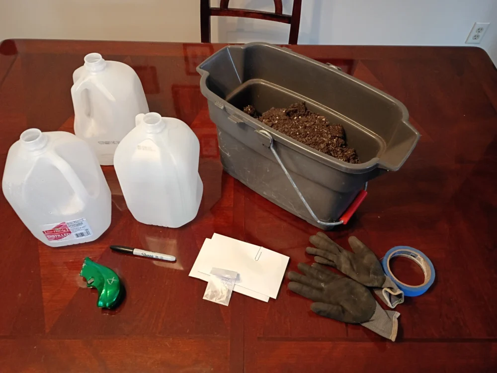 DIY winter sowing supplies including recycled milk jugs, soil mix, and native plant seeds for Midwest ecological restoration